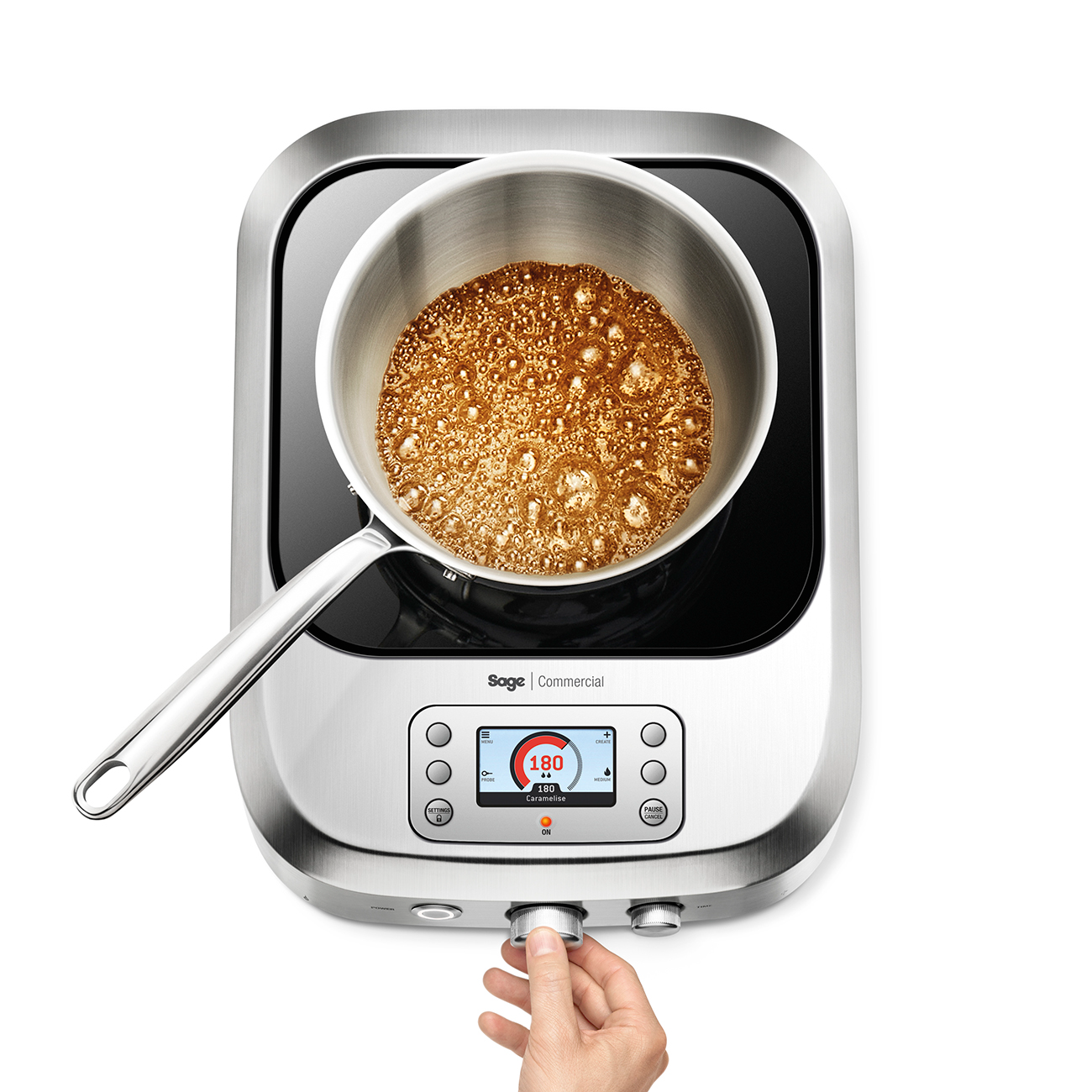 Person adjusting temperature dial of the precision cooker.