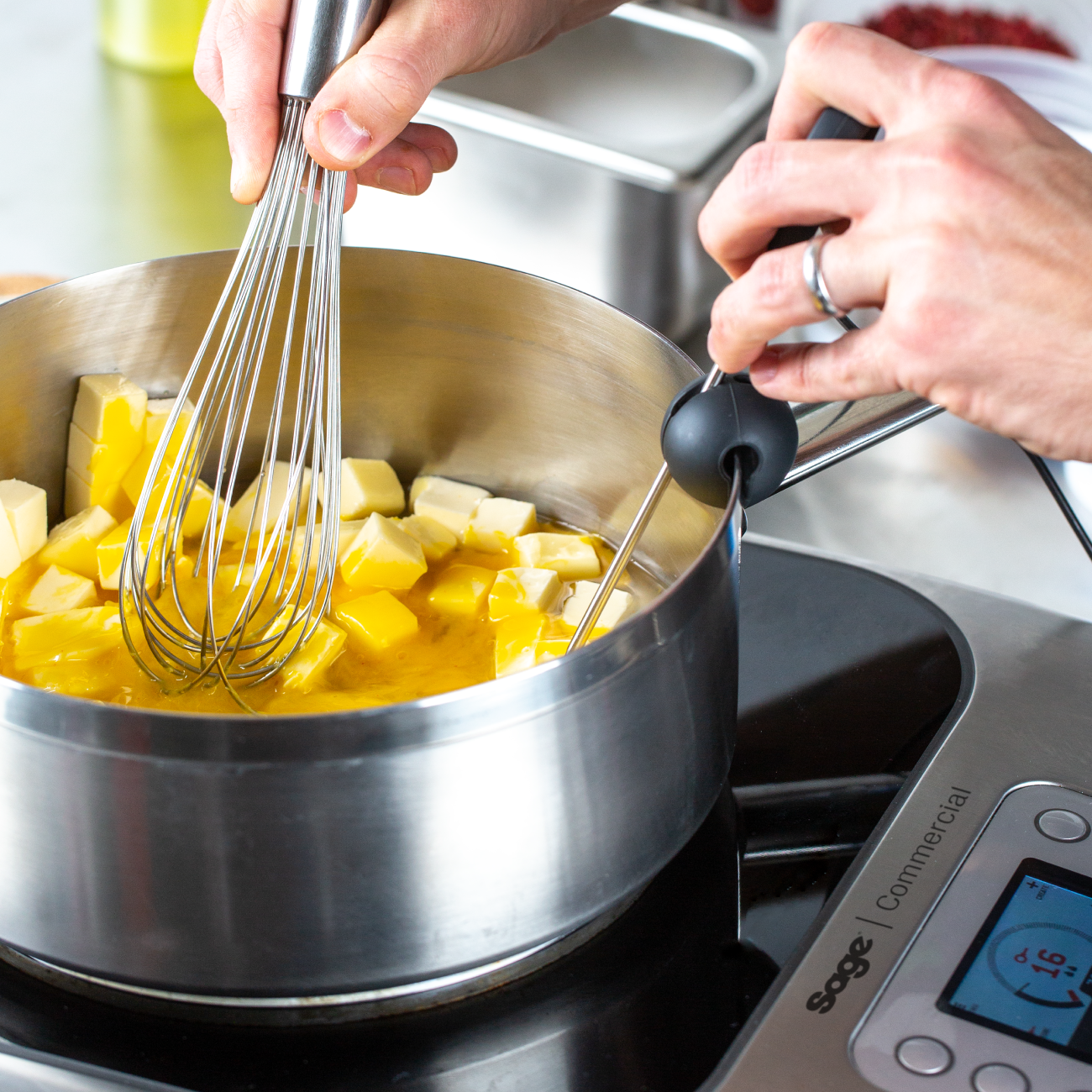 Person adjusting temperature dial of the precision cooker.