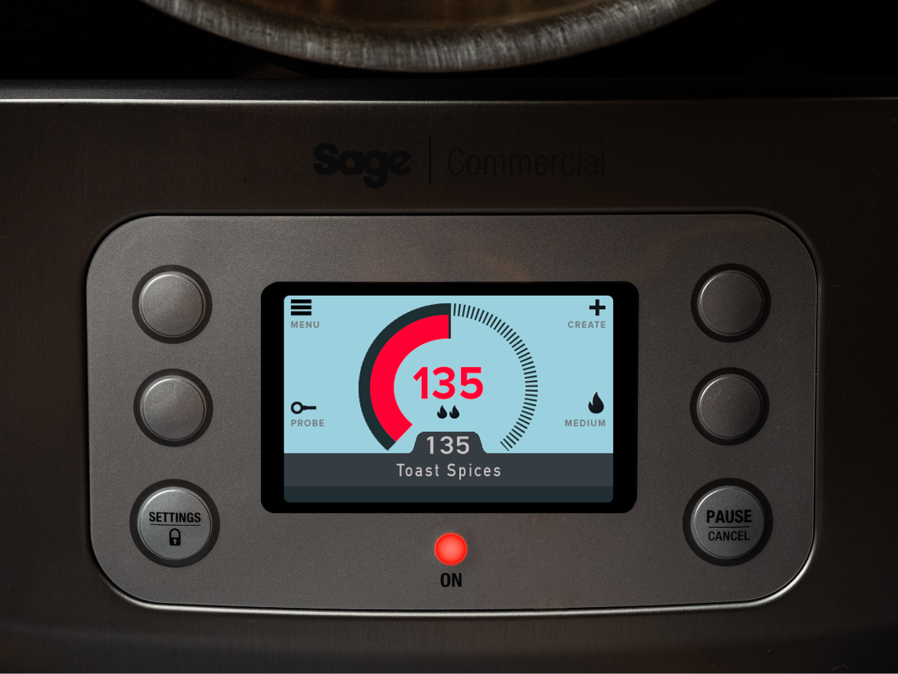 The LED screen on the precision cooker shows the temperature of the spices being toasted in the pot.